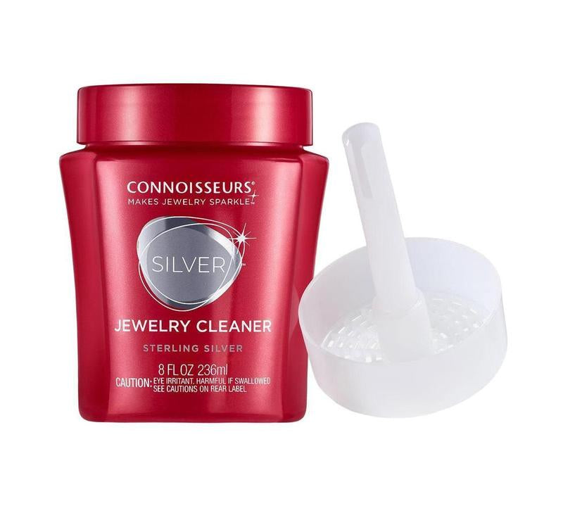 Connoisseurs 8 fl oz red jar of silver jewellery cleaner with a white dip tray for restoring shine to sterling silver.