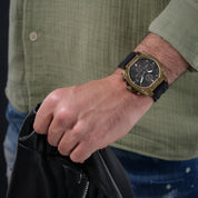 Police Norwood 45mm multifunction watch featuring a bold bronze case, black sunray dial, and durable black silicone strap.