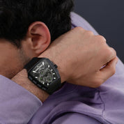 Police Tough Gear watch featuring a black metal case, honeycomb dial with green accents, and a durable black silicon strap.