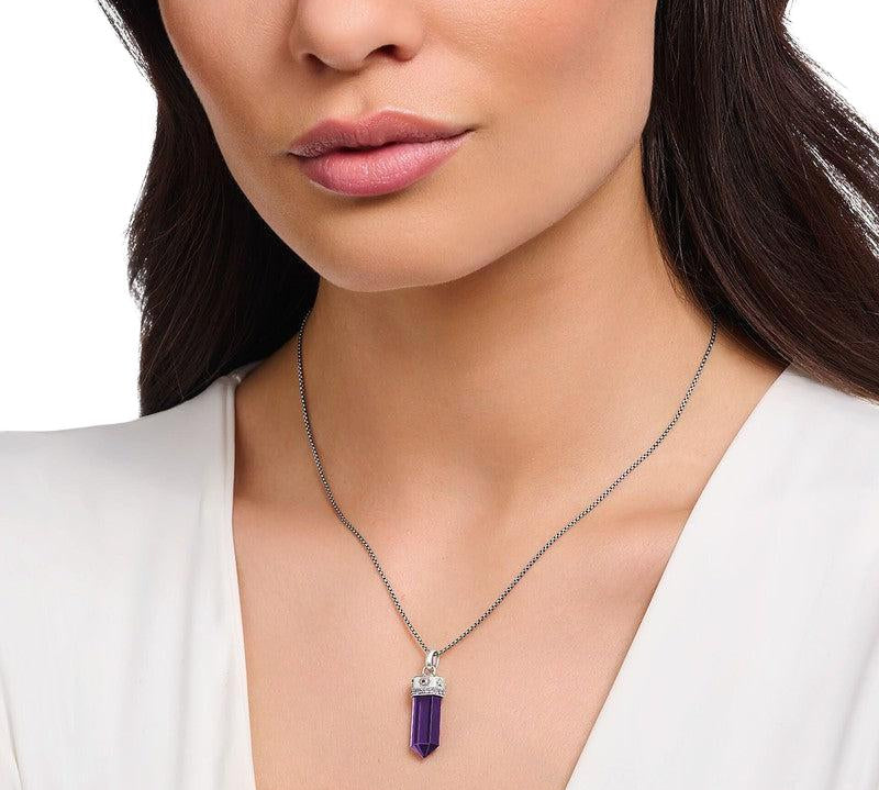 Thomas Sabo blackened silver pendant featuring a hexagonal imitation amethyst with cosmic star and moon symbols on a chain.