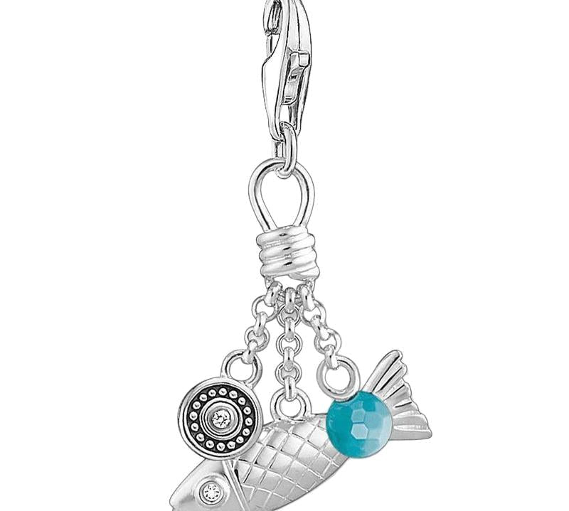 Thomas Sabo sterling silver fish charm featuring intricate scales, a turquoise stone bead, and a decorative circular accent.