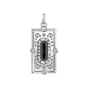 Thomas Sabo rectangular silver pendant with black enamel, celestial engravings, and Trust Your Strength inscription.